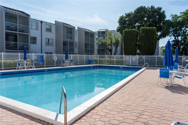 view of swimming pool featuring a patio