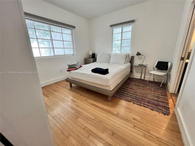 bedroom featuring light wood-type flooring