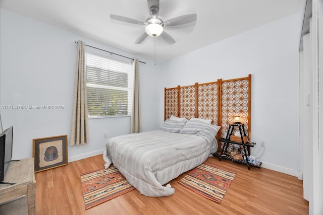 bedroom featuring wood-type flooring and ceiling fan