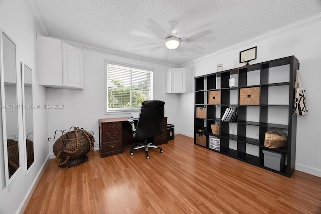 office space featuring a textured ceiling, ceiling fan, and ornamental molding