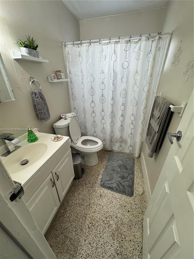 full bathroom featuring vanity, toilet, and shower / tub combo