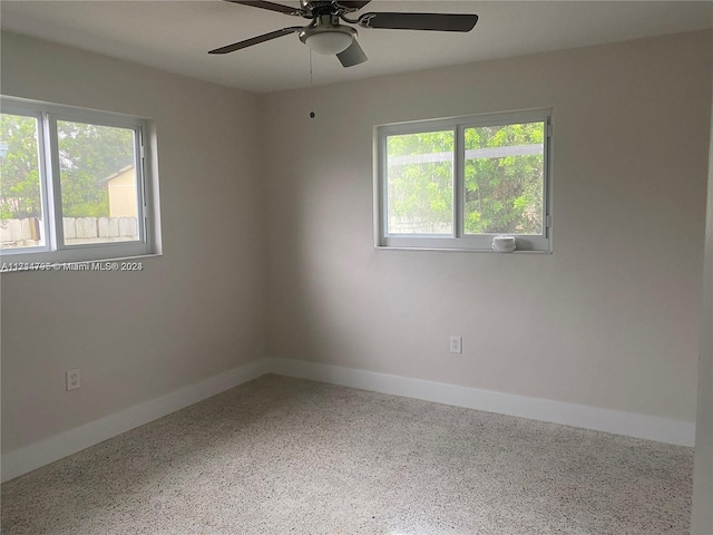 empty room featuring ceiling fan