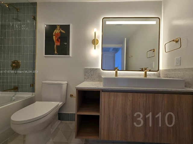 full bathroom with tile patterned flooring, vanity, toilet, and tiled shower / bath