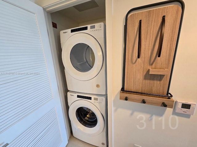 laundry area with stacked washer / drying machine