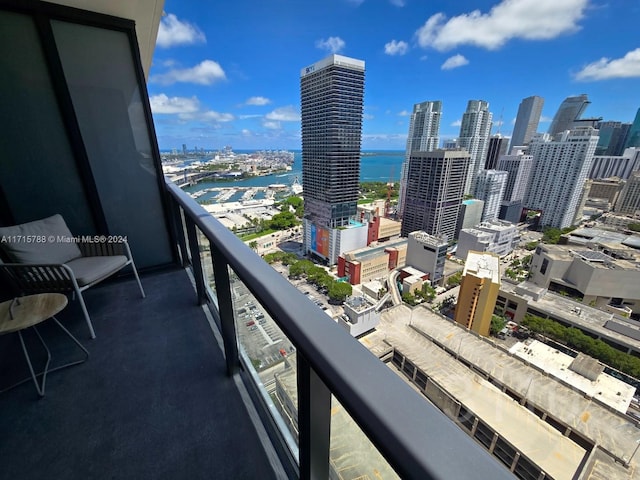 balcony featuring a water view