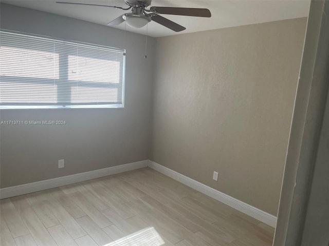 unfurnished room featuring light wood-type flooring and ceiling fan