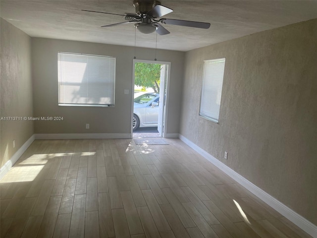 unfurnished room featuring ceiling fan