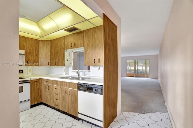 kitchen with light carpet, sink, and white appliances