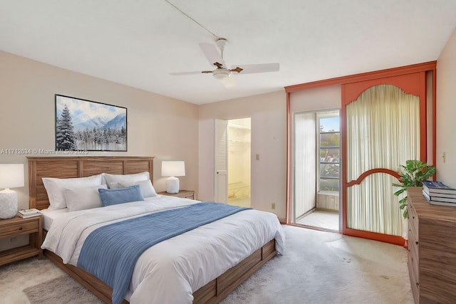 carpeted bedroom with ceiling fan and ensuite bathroom