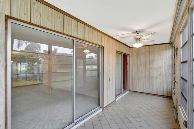 sunroom / solarium with ceiling fan