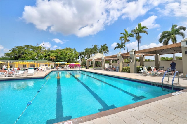 view of swimming pool with a patio and a gazebo