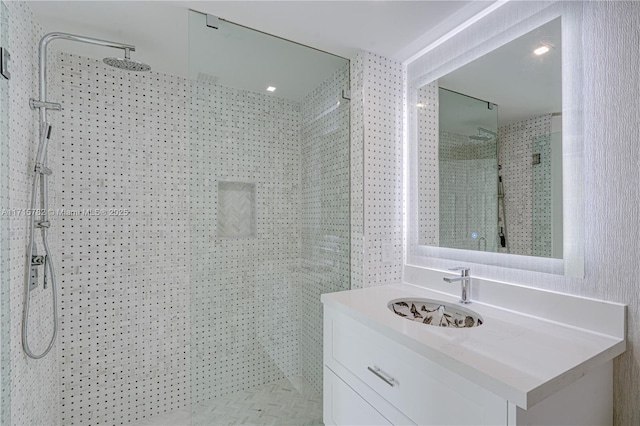 bathroom featuring a shower and vanity