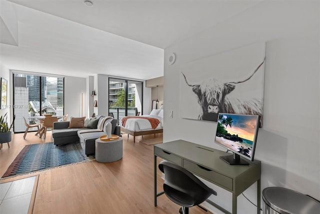 interior space with hardwood / wood-style flooring and floor to ceiling windows