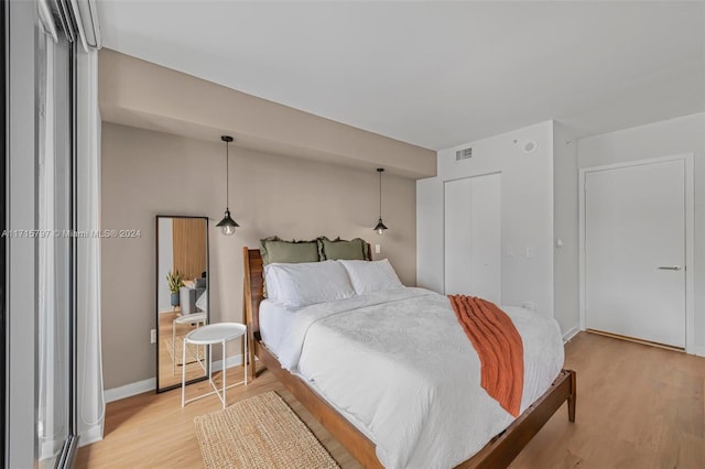 bedroom with light wood-type flooring