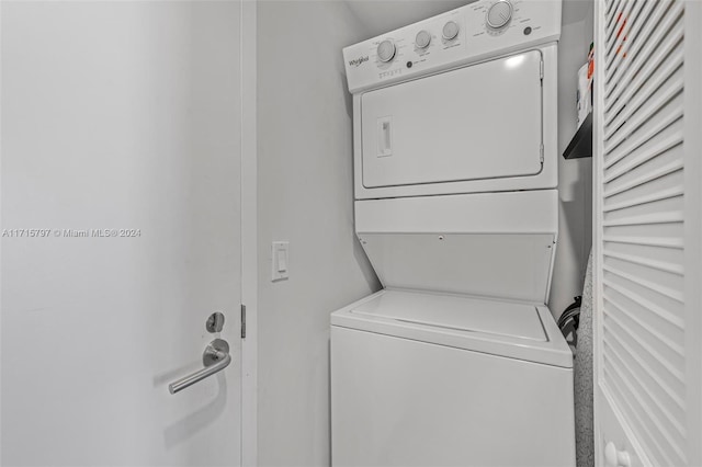 clothes washing area with stacked washer / drying machine