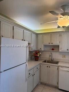 7500 NW 5th Pl Unit 103, Margate, FL 33063 - kitchen with white appliances, light countertops, light tile patterned flooring, and a ceiling fan