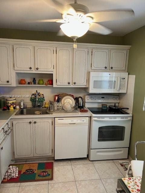 kitchen with ceiling fan, sink, white appliances, decorative backsplash, and light tile patterned flooring