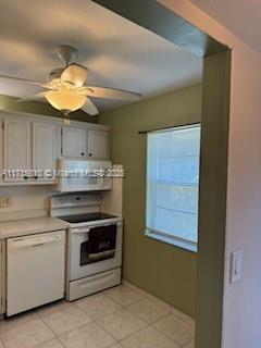 7500 NW 5th Pl Unit 103, Margate, FL 33063 - kitchen featuring white appliances, exhaust hood, light countertops, ceiling fan, and light tile patterned floors