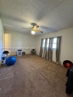 7500 NW 5th Pl Unit 103, Margate, FL 33063 - carpeted empty room featuring ceiling fan and a textured ceiling