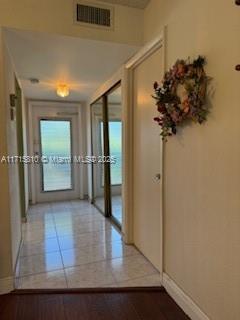 7500 NW 5th Pl Unit 103, Margate, FL 33063 - hall featuring baseboards and tile patterned flooring