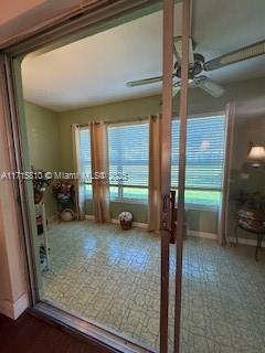 7500 NW 5th Pl Unit 103, Margate, FL 33063 - doorway with tile patterned floors and ceiling fan