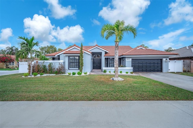 view of front facade featuring a garage and a front yard