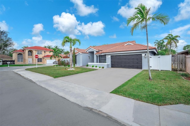 view of front facade with a front lawn and a garage