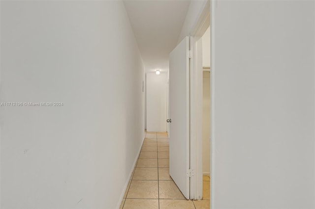 hall with light tile patterned flooring