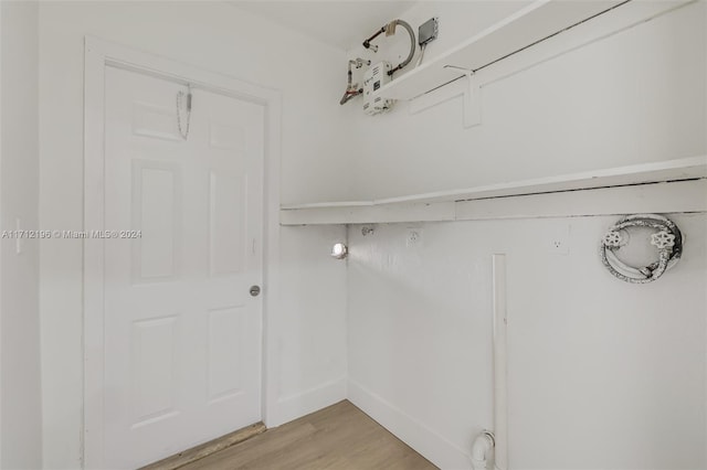 walk in closet featuring light hardwood / wood-style flooring