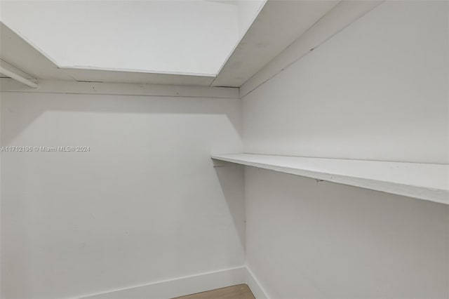 walk in closet featuring wood-type flooring