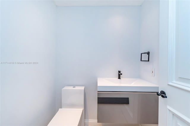 bathroom with vanity and toilet