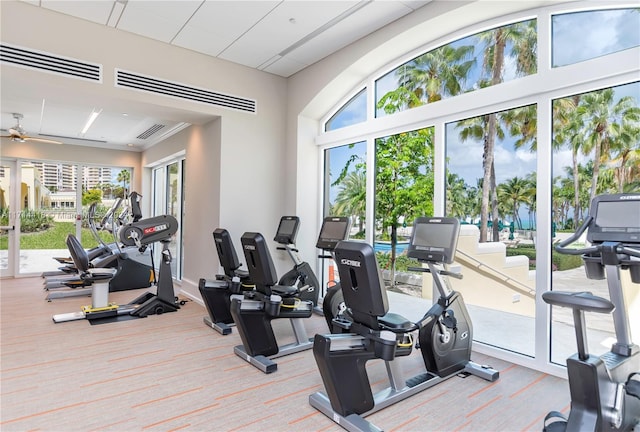 exercise room with ceiling fan