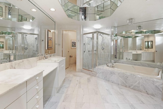 bathroom featuring shower with separate bathtub and vanity