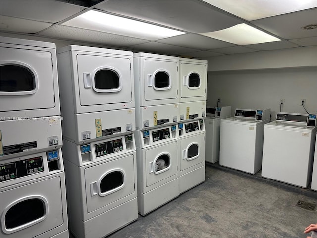 washroom featuring stacked washer and clothes dryer and washer and clothes dryer