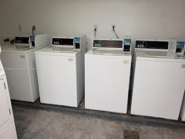 clothes washing area featuring washer and dryer