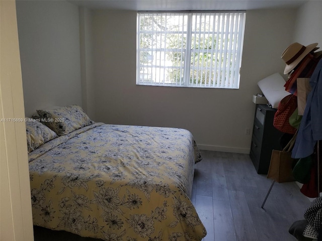 bedroom with hardwood / wood-style floors