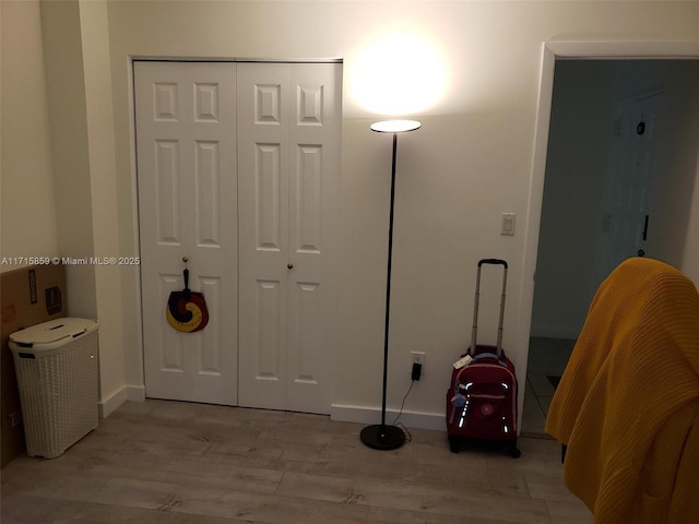 interior space featuring a closet and light wood-type flooring