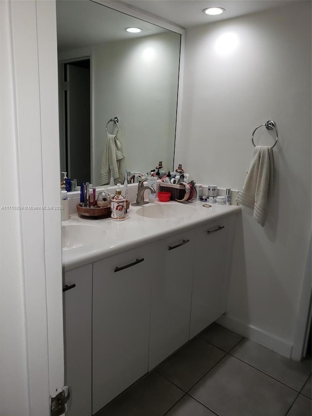 bathroom featuring tile patterned floors and vanity