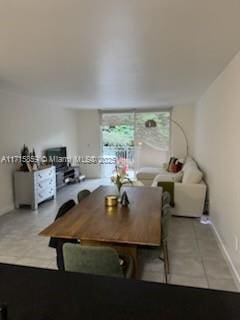 dining area with light tile patterned floors