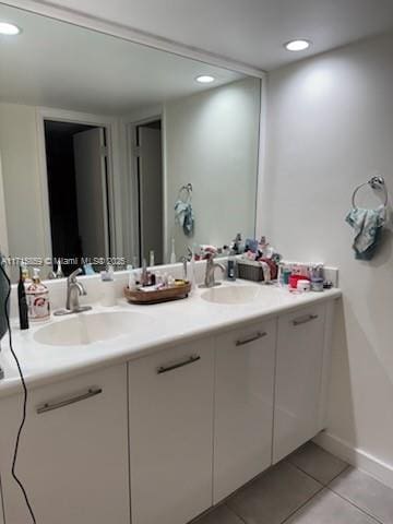 bathroom with tile patterned flooring and vanity