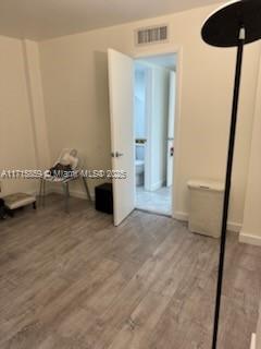 unfurnished bedroom featuring wood-type flooring