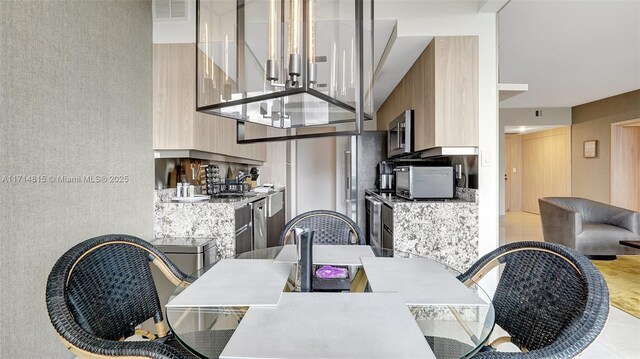 dining room featuring a high ceiling