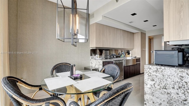 dining space featuring light tile patterned floors