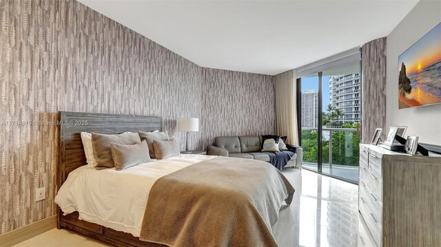 bedroom with access to outside and floor to ceiling windows