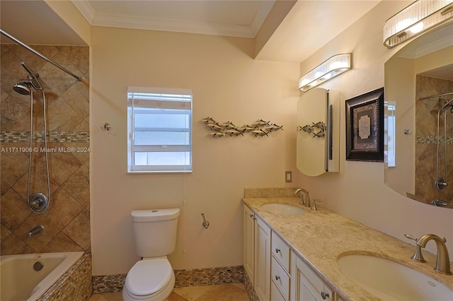 full bathroom featuring vanity, tiled shower / bath combo, toilet, and crown molding