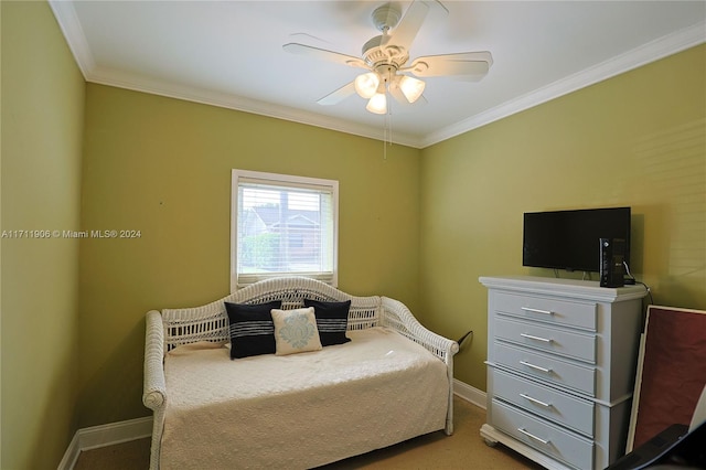 carpeted bedroom featuring ceiling fan and crown molding