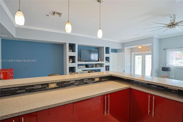 kitchen with ceiling fan, built in features, ornamental molding, and decorative light fixtures