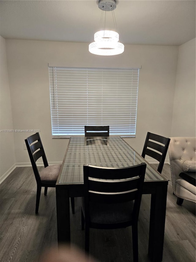 dining space with dark wood-type flooring