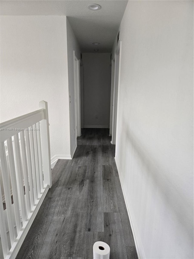 hallway featuring dark hardwood / wood-style floors