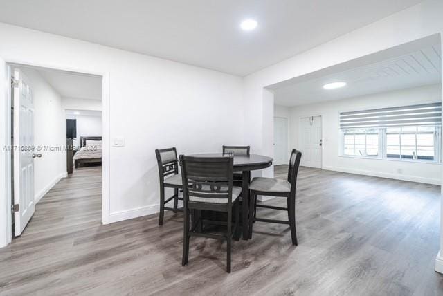 dining area with dark hardwood / wood-style floors